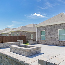 Sculpted Comfort: Large Paver Patio with Fire Pit and Custom Seating Walls